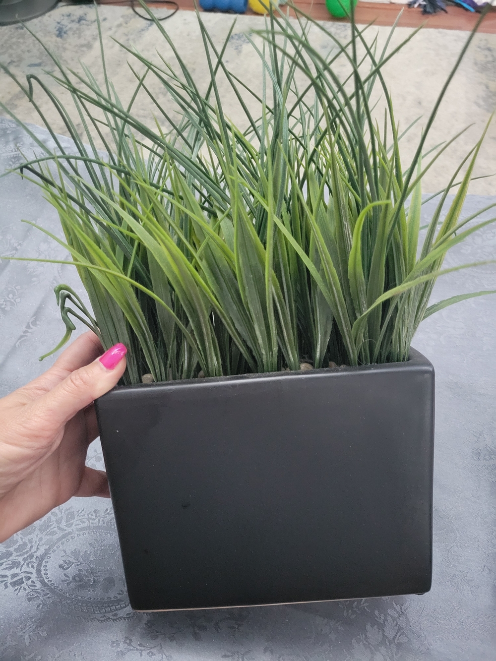 Artificial reeds in stone planter